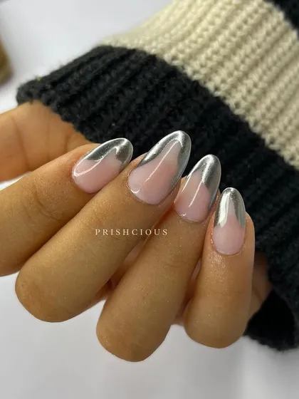The full look of the silver chrome tip nails. The contrast between the shiny, metallic tip and the sheer nude base is so chic and modern.
