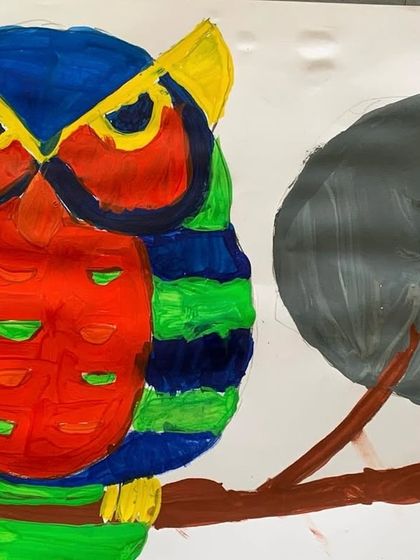This vibrant owl painting shows a great understanding of composition and color balance. The student has placed the owl and moon thoughtfully to create a visually appealing piece.