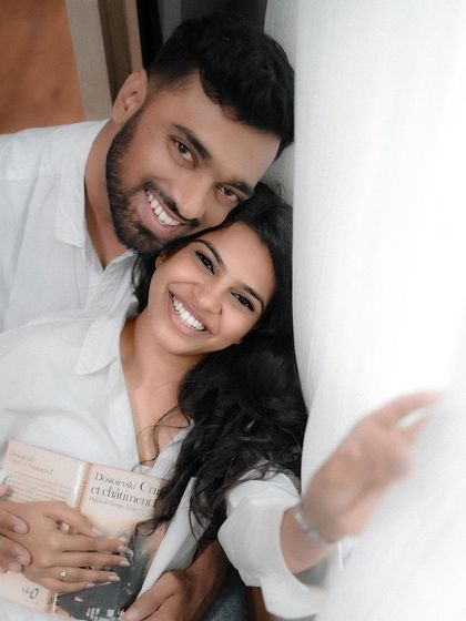 A happy, candid moment from a pre-wedding shoot. The genuine smiles and easy connection are what make these photographs so special and timeless.