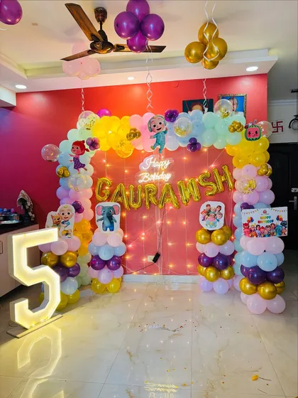 Another shot of the Cocomelon decor, showing the balloons hanging from the ceiling.