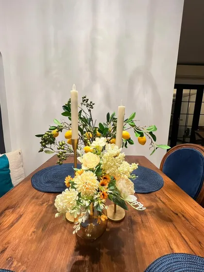 A detail shot of the solid wood dining tabletop, showcasing its natural beauty and finish.