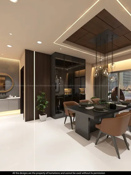 A spacious and elegant dining room. The dark dining table is surrounded by comfortable upholstered chairs, all under a stunning modern chandelier.