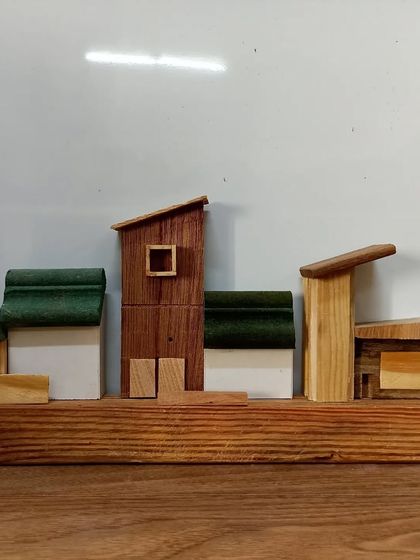A miniature cityscape created entirely from scrap wood. This is a perfect example of how you can turn leftover pieces into a beautiful decorative object.