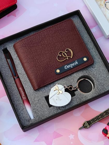 This stylish gift combo for him includes a personalized leather wallet, a dual-shade pen, and a heart-shaped metal keychain that opens to hold two photos.
