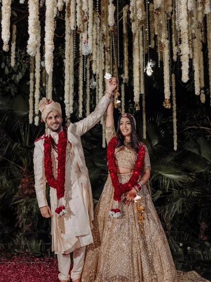 This one was personal. Planning my founder's sister's wedding was all about heartfelt details, and this Varmala moment, with the couple surrounded by a shower of petals, was pure joy.