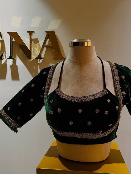This bottle green velvet blouse is designed to elevate your curves. The simple yet elegant hand embroidery in silver adds a touch of sparkle, while the structured cut ensures a flattering fit with any saree or lehenga.
