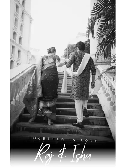 A classic black and white photo of the couple walking up the stairs together. This timeless image focuses on their connection and the beginning of their shared path.