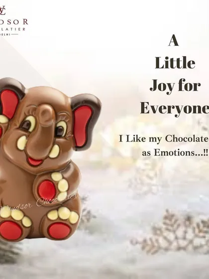 A little joy for everyone with this adorable chocolate elephant. The details are highlighted with red and white chocolate, giving it a cheerful and friendly look.