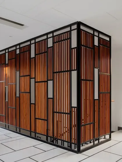 This intricate screen is a functional art piece, dividing space while maintaining a sense of openness. It reflects our focus on context-driven solutions that are both beautiful and purposeful.
