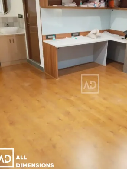 This is a classic laminate wooden flooring I installed in a home office. The warm wood finish adds a professional yet comfortable feel to the room. My wooden flooring options are scratch-resistant and easy to clean, making them a practical choice for both homes and offices.