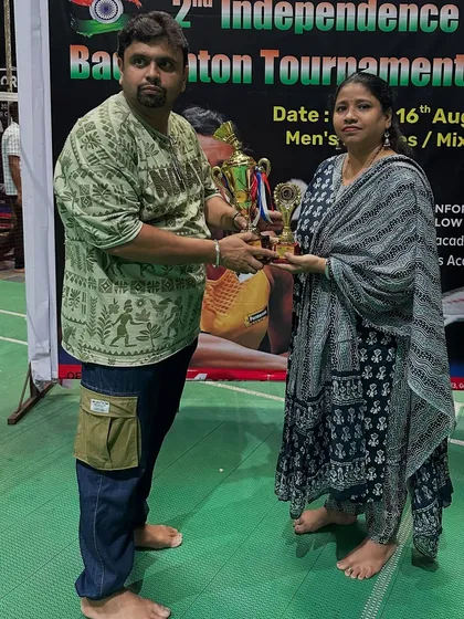 Another D-Group Men's Doubles runner-up, Amey, being awarded for his efforts.