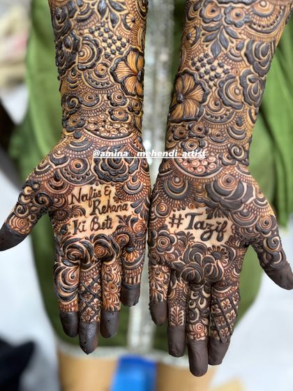 A close-up of the palms, showing the beautiful script of the dedication and the bold wedding hashtag.