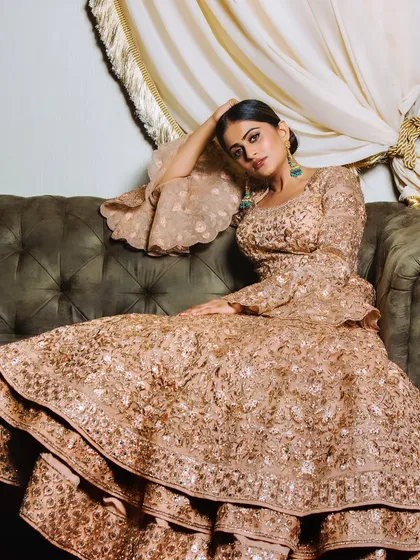 A modern bridal shoot look that's perfect for a reception. The makeup is glamorous and sophisticated, with a focus on creating a high-fashion feel.