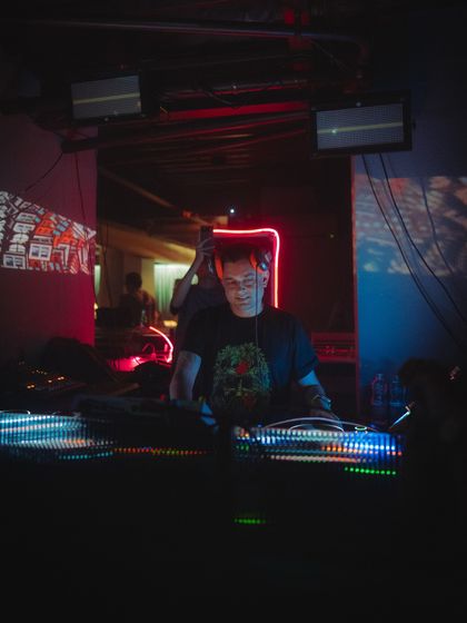 A close-up from a set at the Aftermath weekender. The focus here is on the connection with the gear, with projections adding another layer to the visual experience.