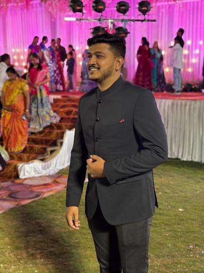The smile says it all. Our client is happy with his choice of a classic black Jodhpuri for a wedding event. It's an affordable way to look sharp.