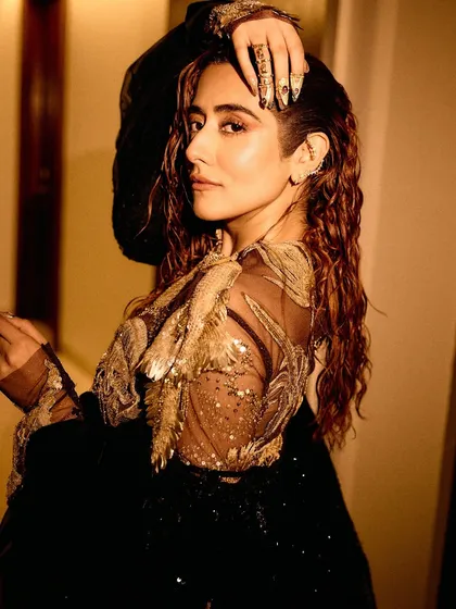 A series of images capturing the stunning Rahul Mishra Couture outfit I styled for Jonita Gandhi's performance. The detailed embroidery, flowing silhouette, and pairing with thigh-high Louboutin boots created a look that was both ethereal and powerful.
