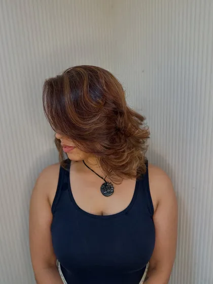 A side profile of this beautiful layered cut. The feathered ends create softness and movement.