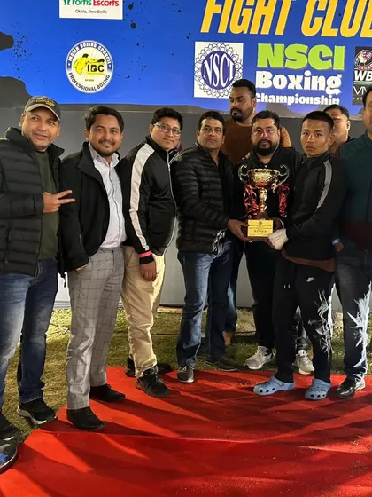 The team celebrating with the championship trophy at the NSCI event. A victory for one is a victory for the whole academy.