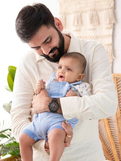 A father's gentle hold. I focus on capturing the details of these interactions, preserving the feeling of safety and love.