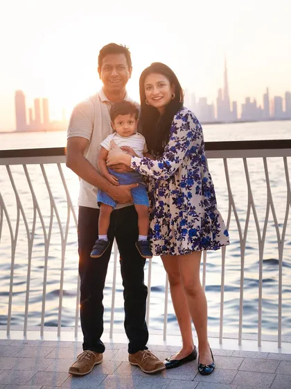 A beautiful family portrait set against the Dubai skyline during the magical golden hour. I offer outdoor sessions in both India and the UAE to capture your memories in stunning natural light.