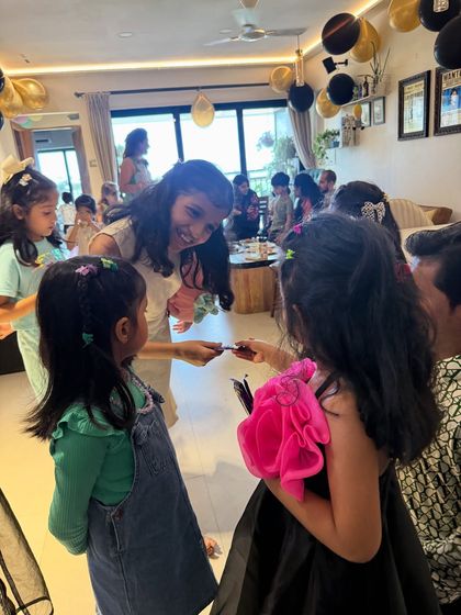 Sharing is part of the magic. After a trick, I love letting the kids examine the props and share in the wonder. It makes them feel like they are part of the secret.