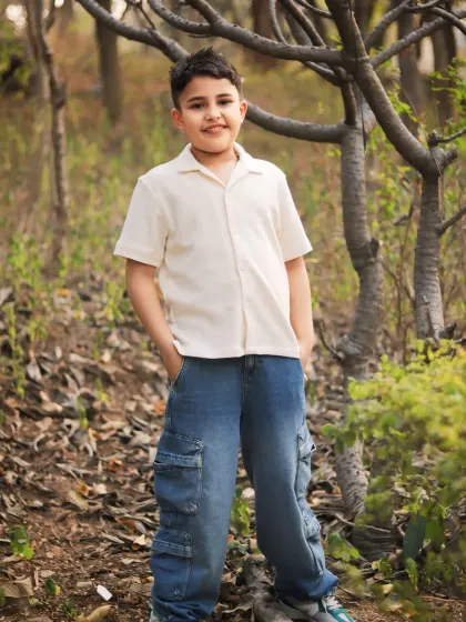 A full-length portrait of a boy enjoying a day outdoors. My goal is to make kids feel comfortable enough to just be themselves in front of the camera.