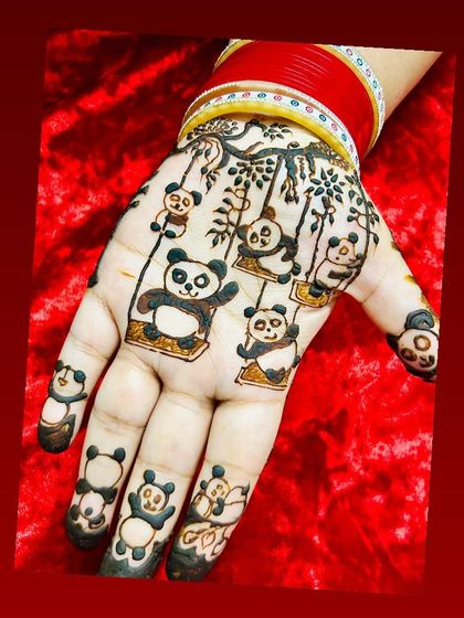 A truly unique and playful design for a panda lover. The entire hand is adorned with adorable pandas swinging from branches, showing that any theme is possible with henna.