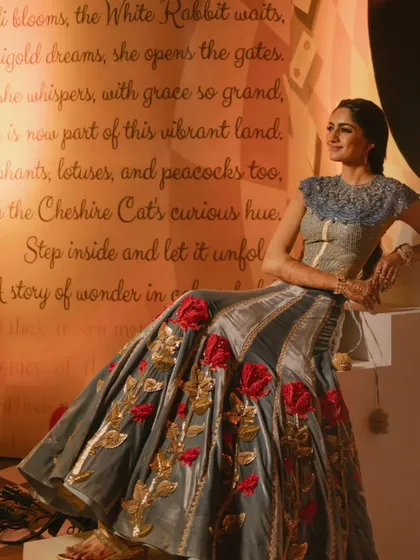 The bride, seated as the protagonist of her own fairytale. The backdrop features a custom-written poem for the couple, an example of the personalized details I incorporate to make your event unique.