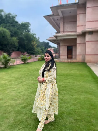 Standing grounded and ready to dance. This full look shows the traditional attire for a festive performance, which helps in getting the feel of the folk dance style right.