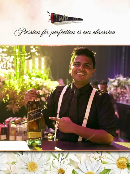 A bartender proudly presents a bottle of Blue Label, showcasing the high-end selection available at our bars.