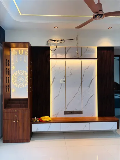The mandir and TV unit shown together, demonstrating how I create a harmonious design for a multi-functional living room wall.