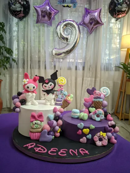 This Kuromi and My Melody cake was made for my daughter's 9th birthday. It features two separate cakes and lots of handcrafted fondant details, showing how I can combine different elements to create a truly personal and magical centerpiece.