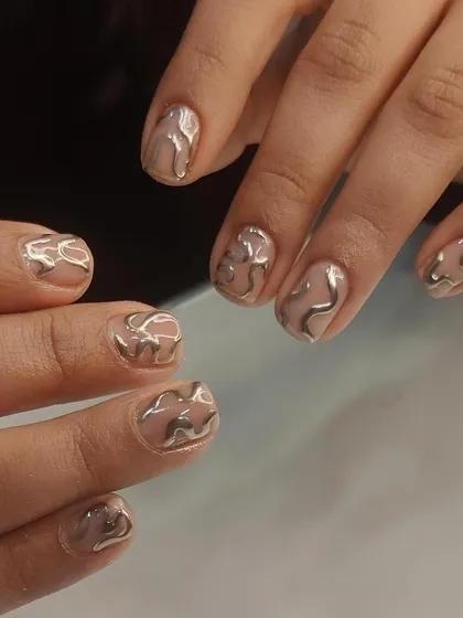 For a trendy and futuristic vibe, I create these 3D chrome swirls. The liquid-metal effect on a neutral base is perfect for anyone looking for an edgy yet chic design.