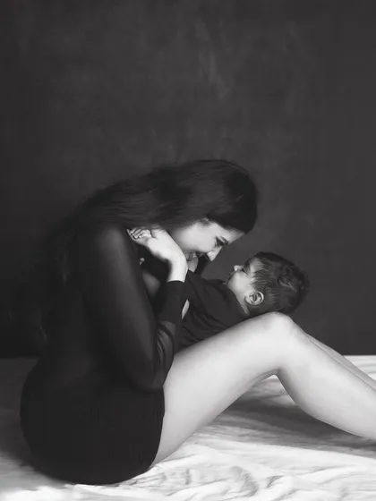 A tender moment between mother and child, captured in a classic black and white style that feels both modern and timeless.