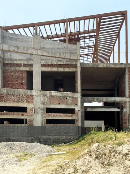 The Sitarganj Residence in Uttarakhand during its construction phase. This image shows the concrete and steel frame, the skeleton upon which the final design will be built.