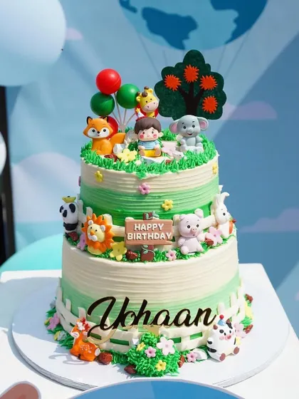 I don't usually do children's cakes, but this one was too cute not to share. A two-tiered Belgian chocolate cake with a farm animal theme for a special birthday.