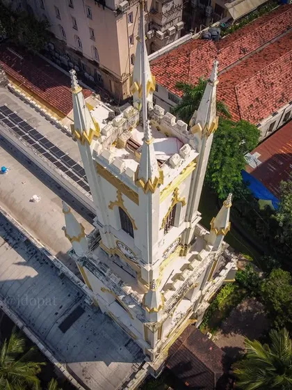 A top-down drone shot of St. Thomas Cathedral in Mumbai, known as Bombay's Zero Point, highlighting its Gothic architecture.