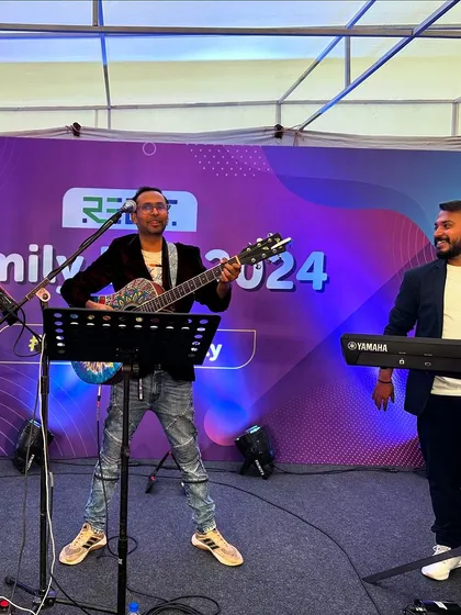 Our guitarist and keyboardist enjoying the performance at the Rebit Family Day event.