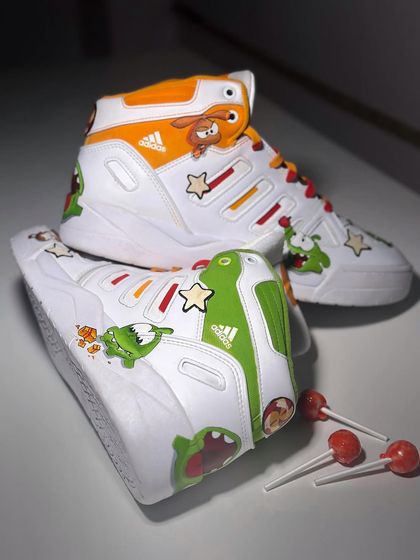 Remember the game Cut the Rope? I brought Om Nom to life on these Adidas Mid City sneakers. I used 3D leather patches to make the characters pop and even made the laces look like the rope from the game.