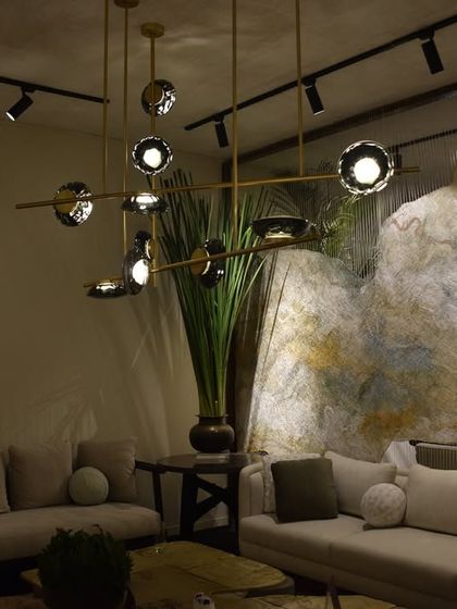 The Ceto series by Ross Gardam, seen here at the India Art Fair, is integrated into a sophisticated lounge setting, its organic glass forms adding a touch of nature-inspired design.