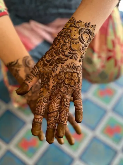 Another angle of this floral design, showing the detail on the back of the hand. The wrist cuff with a large rose is a particular favorite of mine.
