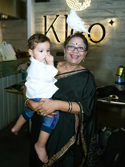 Family celebrations are about every generation. Here we captured a sweet, candid moment between a grandmother and her grandchild during a family event.