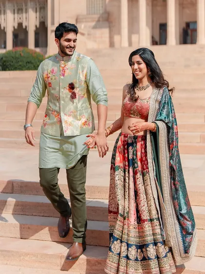 A beautiful candid moment from a Mehendi ceremony. The makeup is classic, natural, and effortlessly chic, with a focus on soft, dewy skin that looks radiant in the daylight.