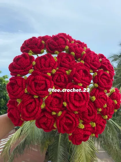 A full bouquet of classic red roses with green sepals.