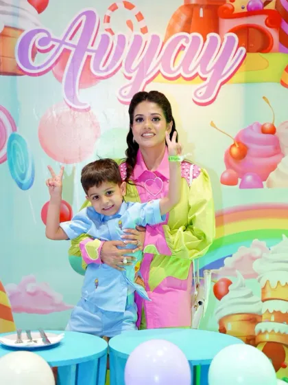 A heartwarming photo of mother and son enjoying the candy-themed birthday party. Our events are designed for creating beautiful family memories.