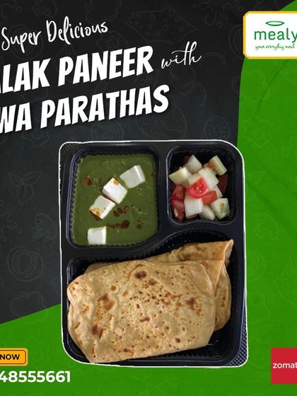 A healthy and classic choice, our Palak Paneer with Tawa Parathas. This meal combo includes soft paneer cubes in a smooth spinach gravy, served with parathas and a side salad.