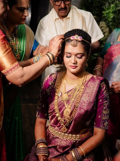 A moment from the Muhuratam ceremony. The makeup is designed to be long-lasting and look beautiful through all the traditional rituals.