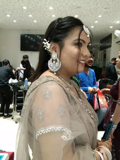 A side view of the engagement party look, showing the elegant hairstyle with a simple twist and how the makeup looks from every angle.