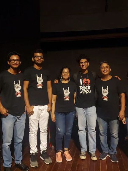 Our dedicated Hum & Strum Whitefield team posing with the founder at Jagriti Theatre after a successful student concert. It takes a village to put on a show like this.