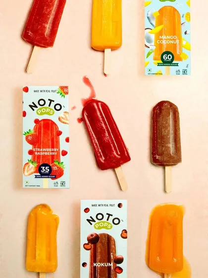 For this shot, we created a playful, slightly messy flat lay to showcase the variety of ice pop flavors. The melting pop adds a touch of realism and urgency, making you want to grab one before it's too late.
